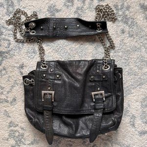 Pour La Victoire black leather purse with silver chain.